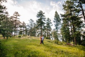Mount Falcon couple in the middle of a field dancing